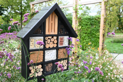 Decorative Insect house with compartments and natural components.